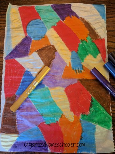 parchment paper painted bold colors with Kwik Stix paint sticks