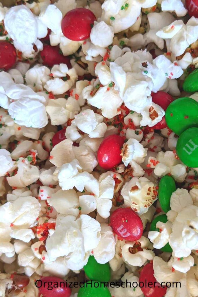 Christmas popcorn with red and green M&Ms and sprinkles
