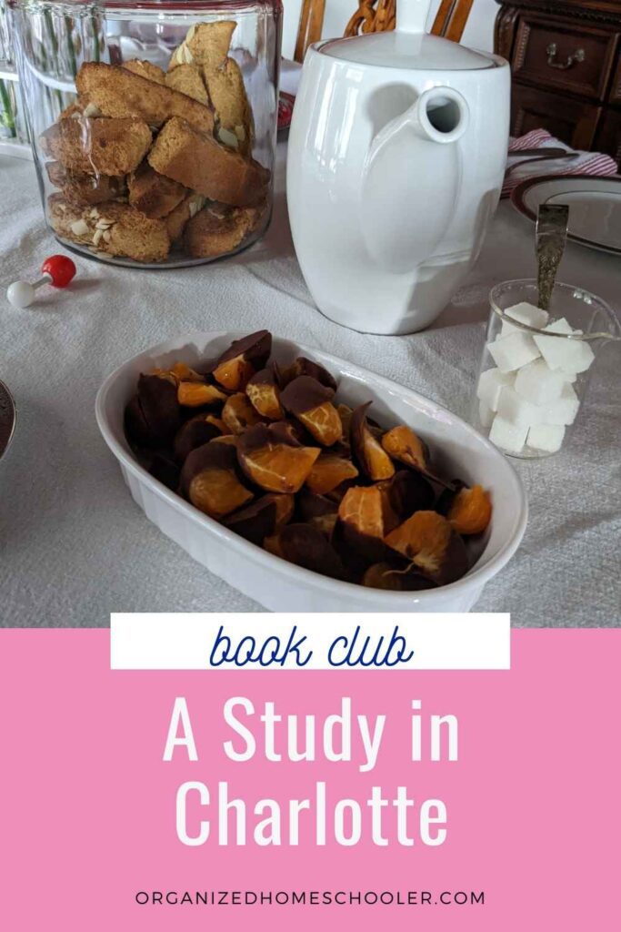 A Study in Charlotte written below a table full of snacks and tea